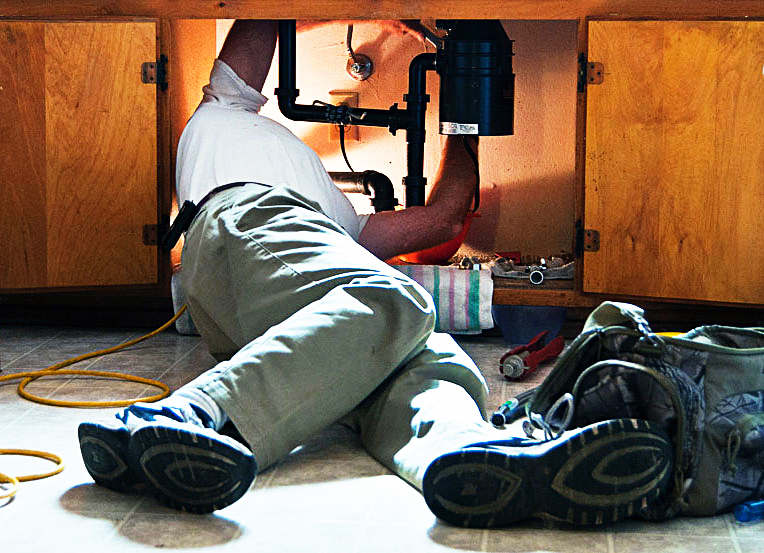 plumber reseats noisy garbage disposal