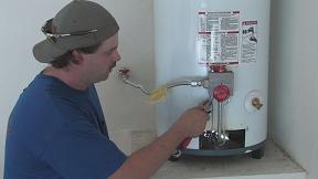 plumbing contractor in Forth Worth Texas works on water heater